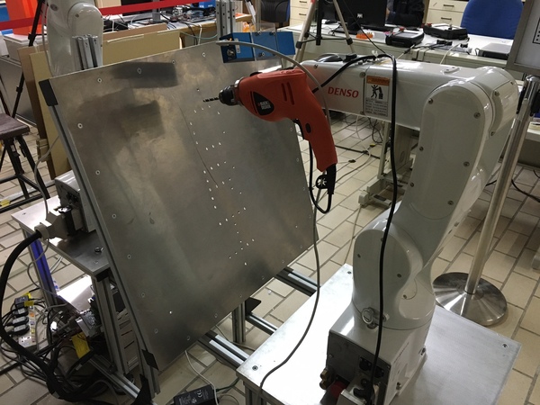 Bringing the drill bit to the desired position and orientation
(perpendicular to the panel).
